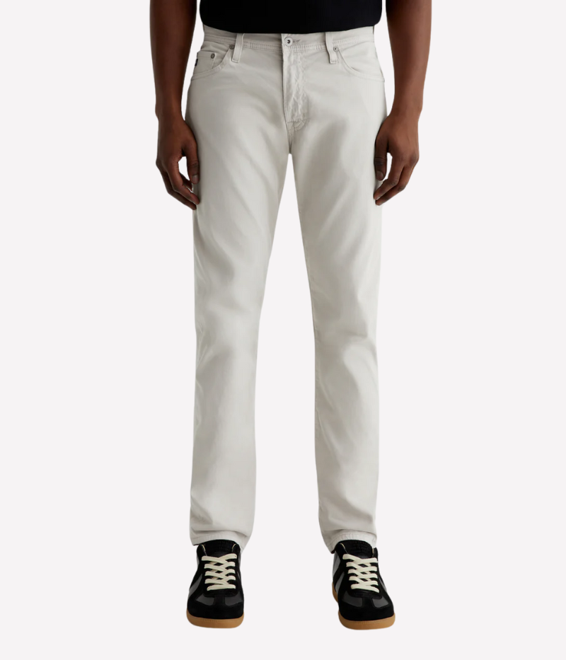 Men’s slim-fit five-pocket pants in an ultra-pale grey, crafted from soft and lightweight Italian Sueded Stretch Sateen. Features a mid-rise waist, fitted upper block, and tapered leg for a modern, polished look.