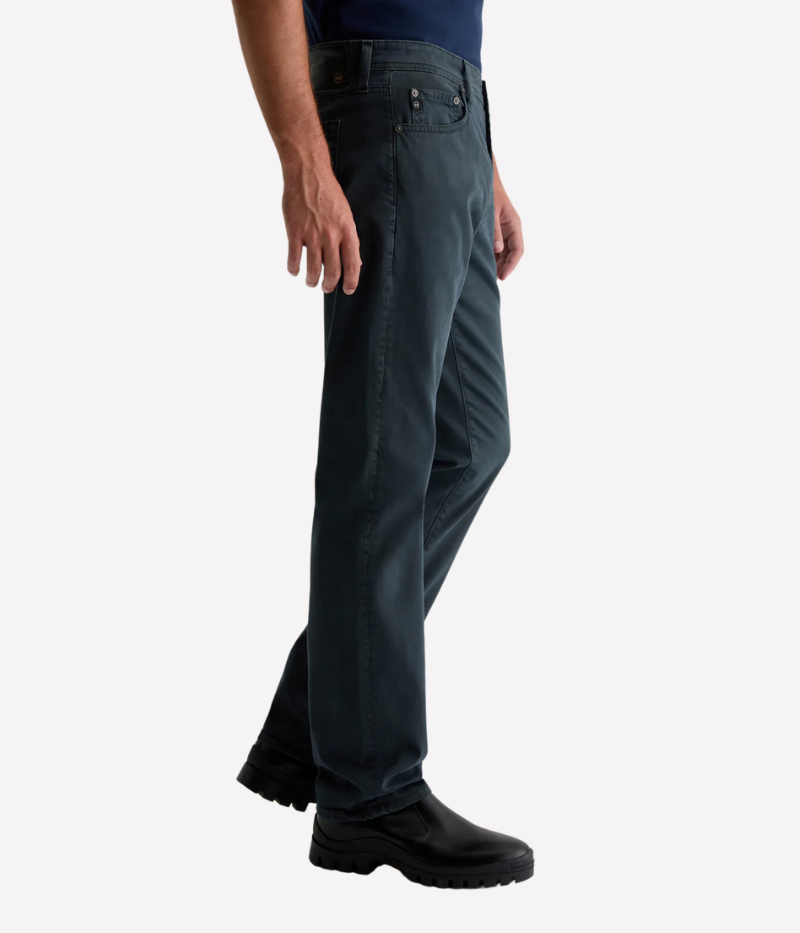 AG's Everett slim-straight men's pants in dark grey, crafted from 8.4 oz. Sueded Stretch Sateen from Italy. Featuring a mid-rise waist and a straight fit relaxed from hip to knee with a slight taper at the leg opening. Detailed measurements include a 10 1/4" front rise, 16 1/2" knee opening, 15" bottom opening, and 34" inseam.