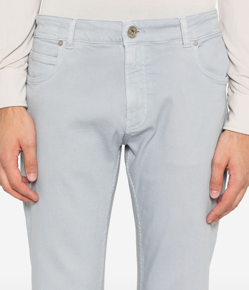 Close-up of Eleventy denim pants in light blue, highlighting the soft cotton blend fabric and the classic five-pocket design.