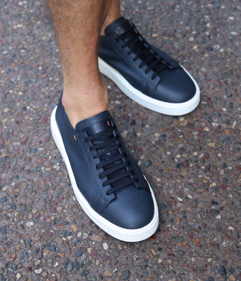 Low-top sneaker with a sturdy rubber sole, lace-up design, and removable insole. Crafted from 100% calf leather with a luxurious leather upper and lining, offering a blend of elegance and practicality. Made in Italy