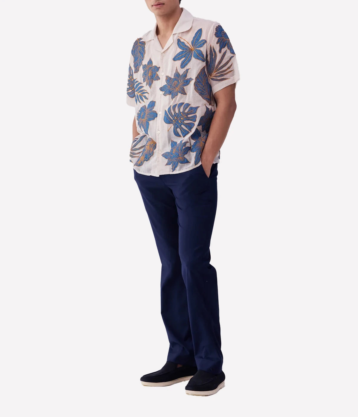 Perte D’ego Blue Floral Appliqué Shirt made from sheer, lightweight cotton mesh, featuring hand-embroidered floral appliqué detailing on the front. Relaxed fit, short sleeves, and a breezy design, perfect for beachside styling or warm-weather occasions.