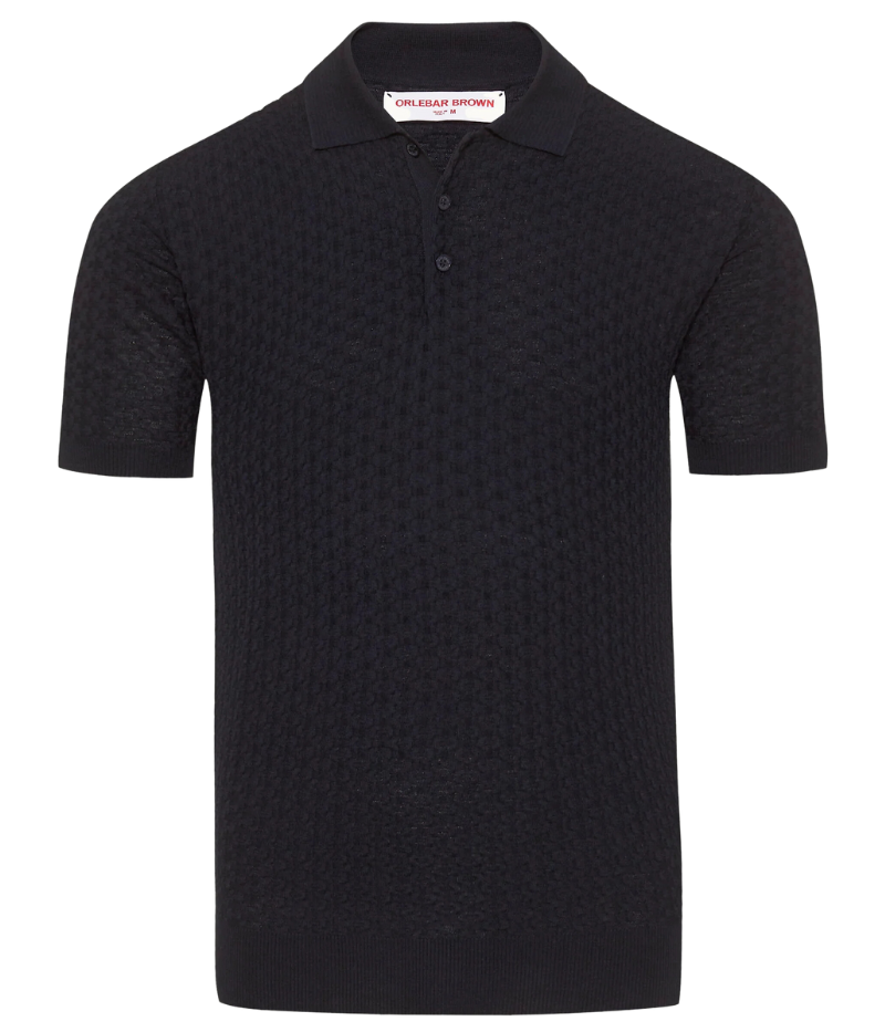 Burnham Italian knit polo shirt in dark navy with lattice pattern, crafted from a silk-cotton blend. Tailored fit, three-button placket, and hand-stitched O.B. detail near the hem.