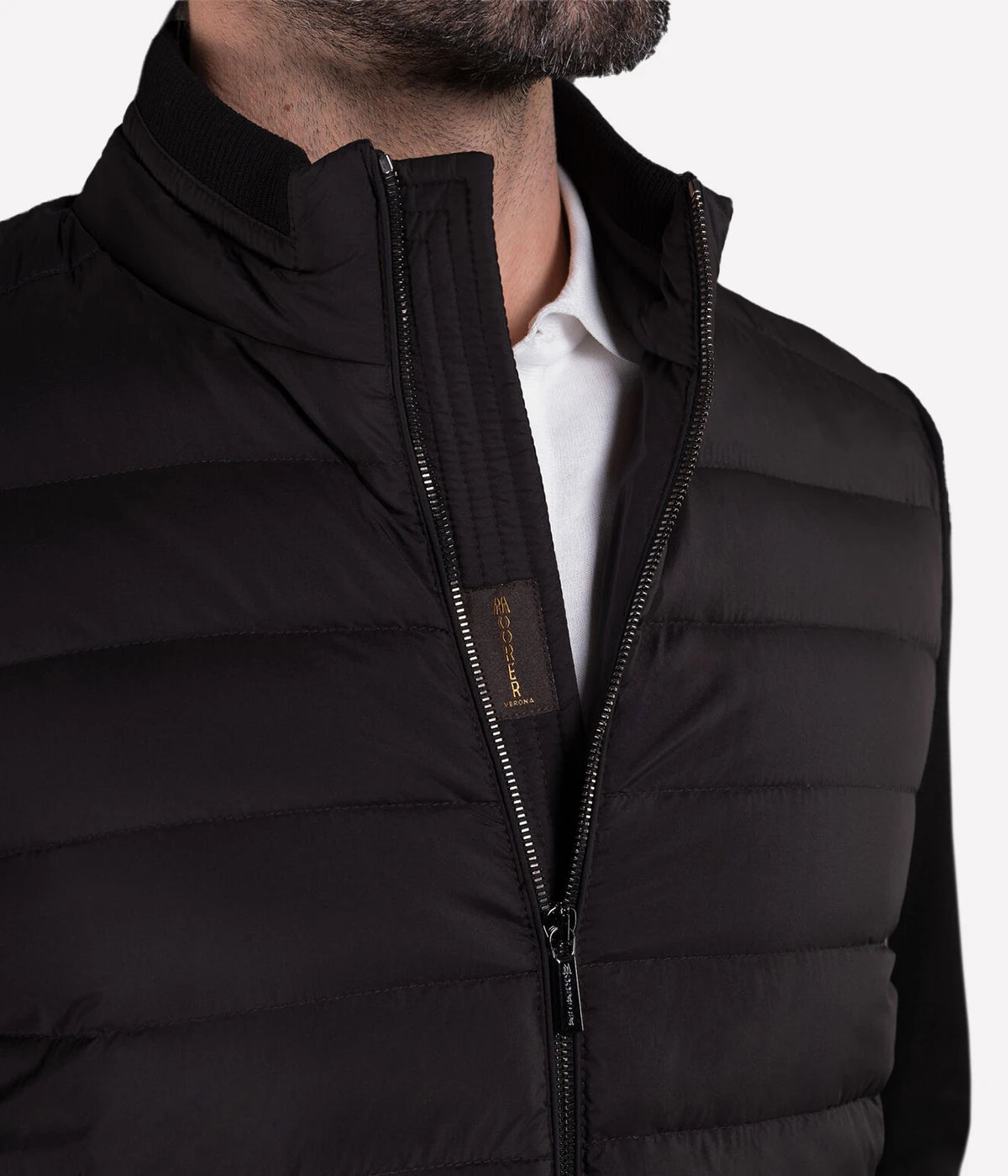 Cattaneo Jacket in a sleek, lightweight design, featuring quilted goose down padding, a ribbed collar, rib-knit lined sleeves, and a two-way metal zip closure. Crafted from water-repellent fabric with cotton knit panels, finished with vertical zip side pockets and internal document pockets. Made in Italy.