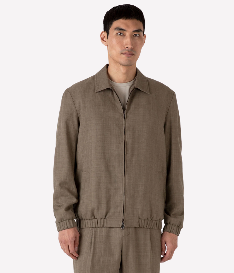 Lightweight blouson jacket in pure cotton with a cross-hatch raffia texture. Features a regular fit, double-ended zip, and an elasticated waist for a relaxed yet refined silhouette.