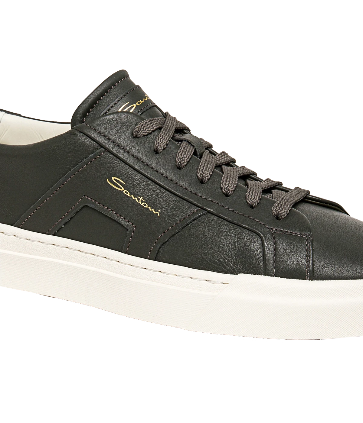 Santoni Double Buckle Sneaker crafted from smooth leather with a low-top silhouette and signature double buckle detail. Set on a rubber sole for comfort and durability, this sneaker adds a refined, modern edge to any outfit. Runs large; size down half a size.