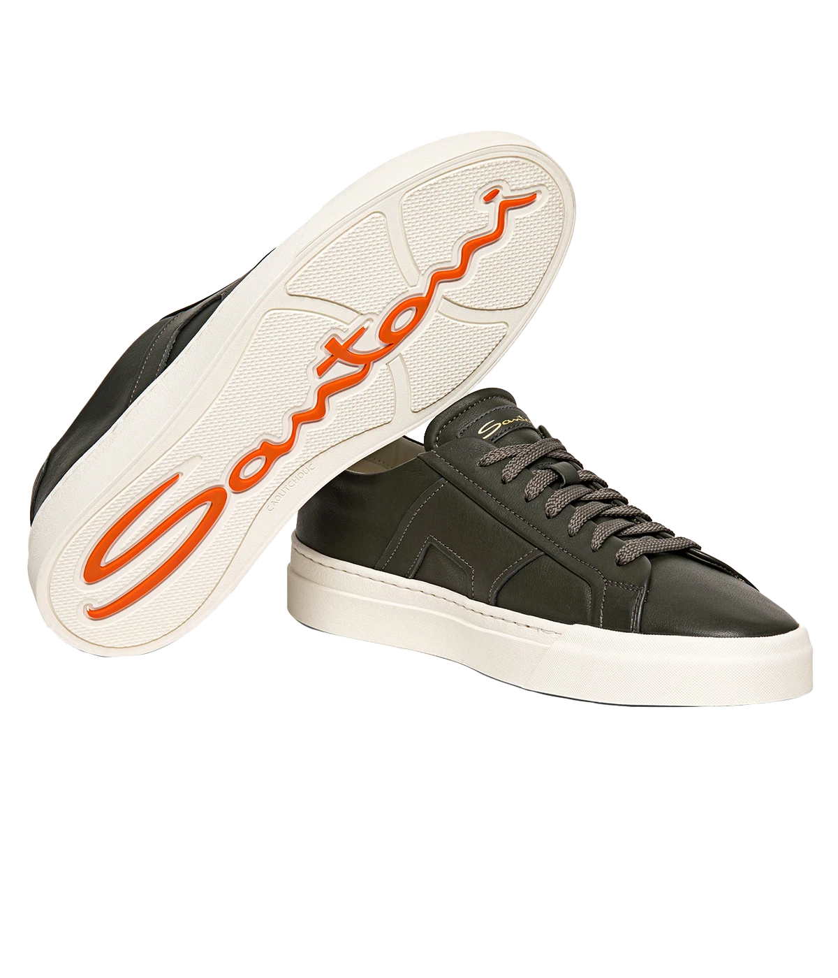 Santoni Double Buckle Sneaker crafted from smooth leather with a low-top silhouette and signature double buckle detail. Set on a rubber sole for comfort and durability, this sneaker adds a refined, modern edge to any outfit. Runs large; size down half a size.