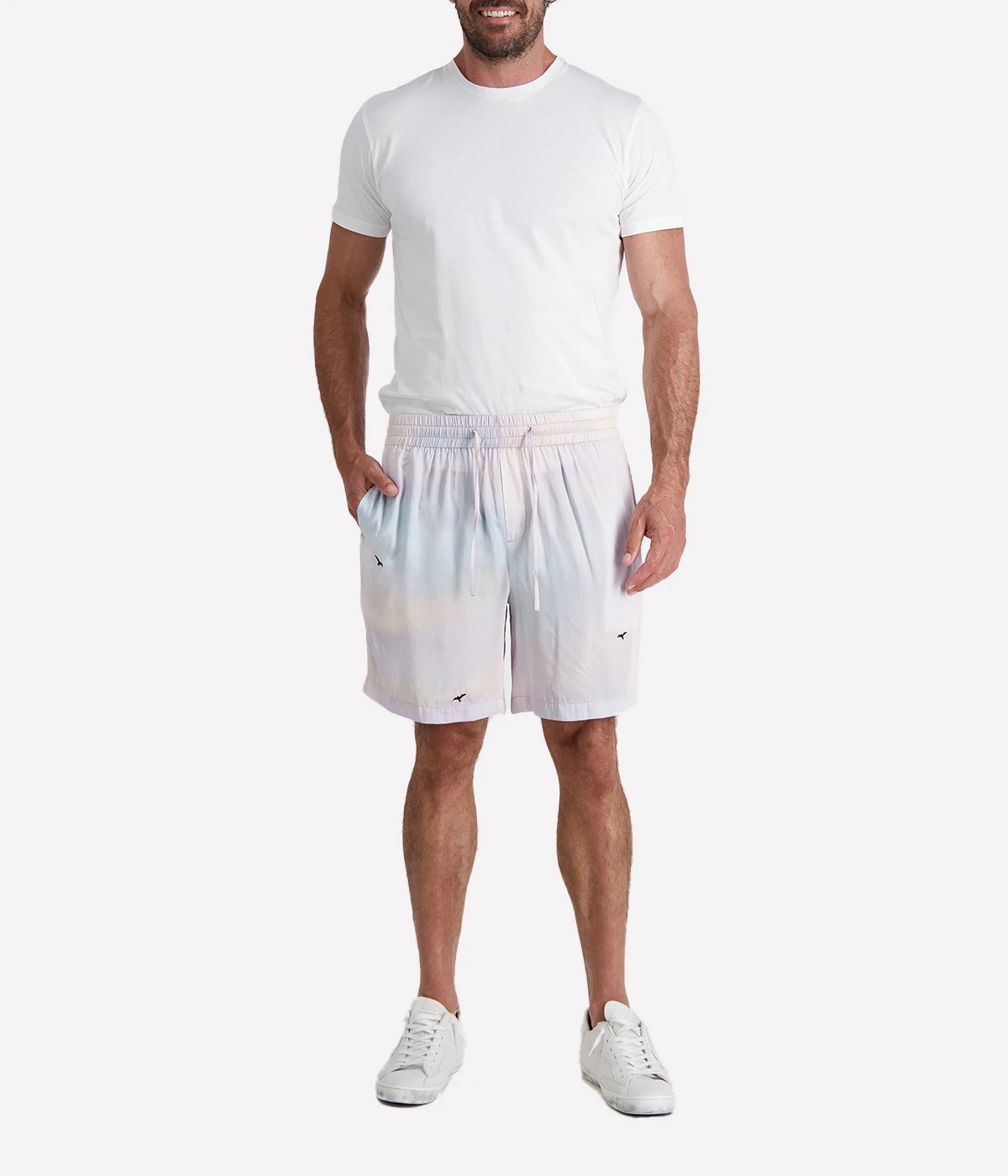 Light purple gradient casual shorts by Perte D’ego, featuring an elasticated waistband, adjustable drawstring, and a subtle bird print. Made from a lightweight fabric for effortless summer style.