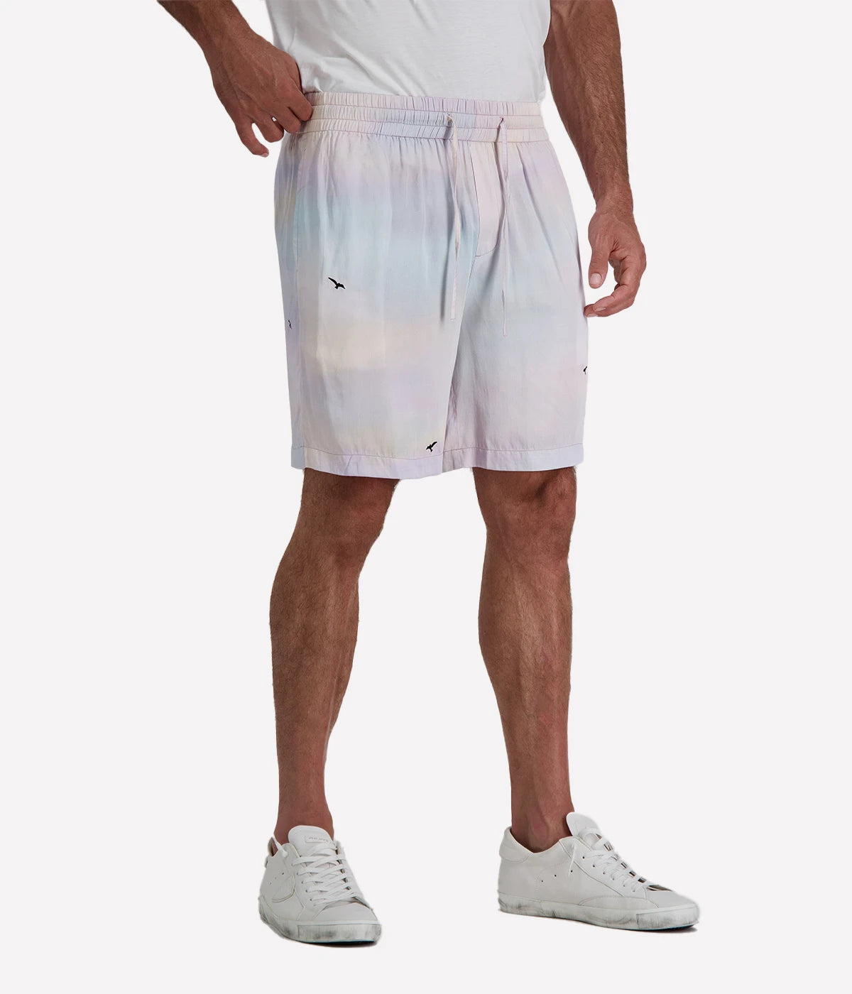 Light purple gradient casual shorts by Perte D’ego, featuring an elasticated waistband, adjustable drawstring, and a subtle bird print. Made from a lightweight fabric for effortless summer style.