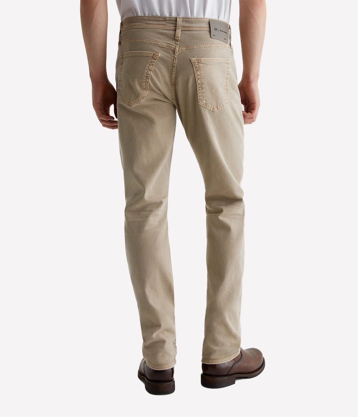 The Everett slim-straight jeans in sulfur-dyed khaki offer a relaxed fit with a tapered leg, AG-ed™ fading, and a velvety-soft feel thanks to Cloud Soft Denim™. Stretch and recovery ensure all-day comfort.