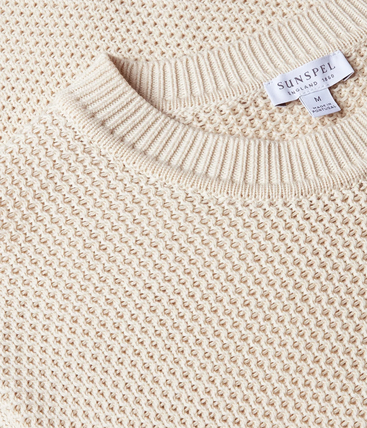 Ecru honeycomb-knit cotton sweater with ribbed trims and a clean tubular seam at the neck for a refined, effortless look.