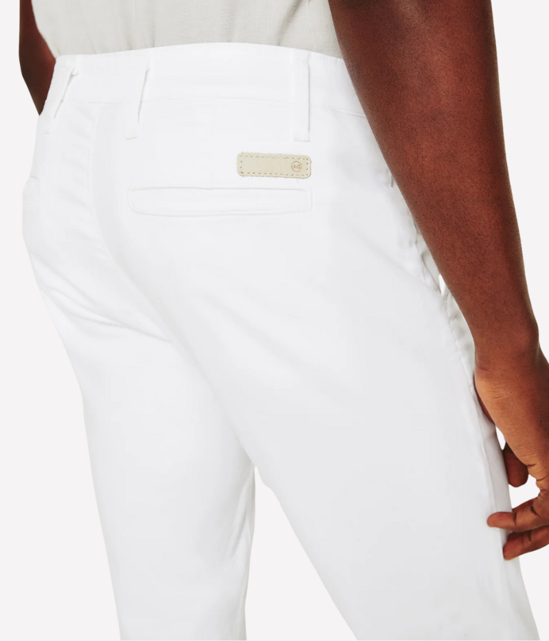 AG Jamison Chino in White—slim skinny men’s trouser with a tailored fit, tapered leg, and lightweight stretch sateen fabric for a refined yet comfortable finish. Features slash front pockets and buttoned welt back pockets.