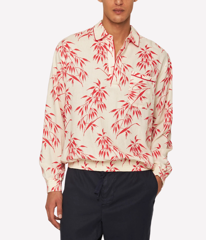 Lakewood long-sleeve overhead shirt in printed linen with red bamboo design, featuring concealed placket, classic collar, pleated back yoke for ease of movement, and branded imitation mother of pearl buttons.