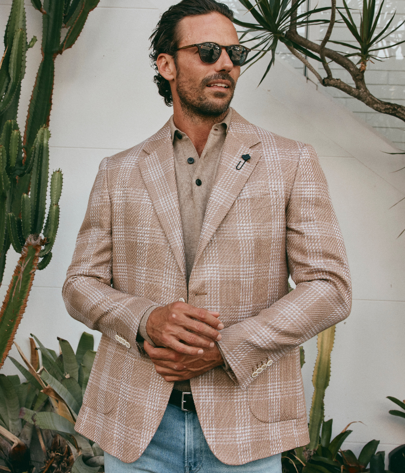 Beige and cream checked Lardini blazer made from a cotton and flax blend, featuring a single-breasted design, signature lapel flower, and a lightweight, half-lined interior.