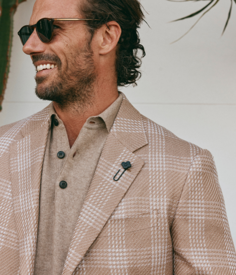 Beige and cream checked Lardini blazer made from a cotton and flax blend, featuring a single-breasted design, signature lapel flower, and a lightweight, half-lined interior.