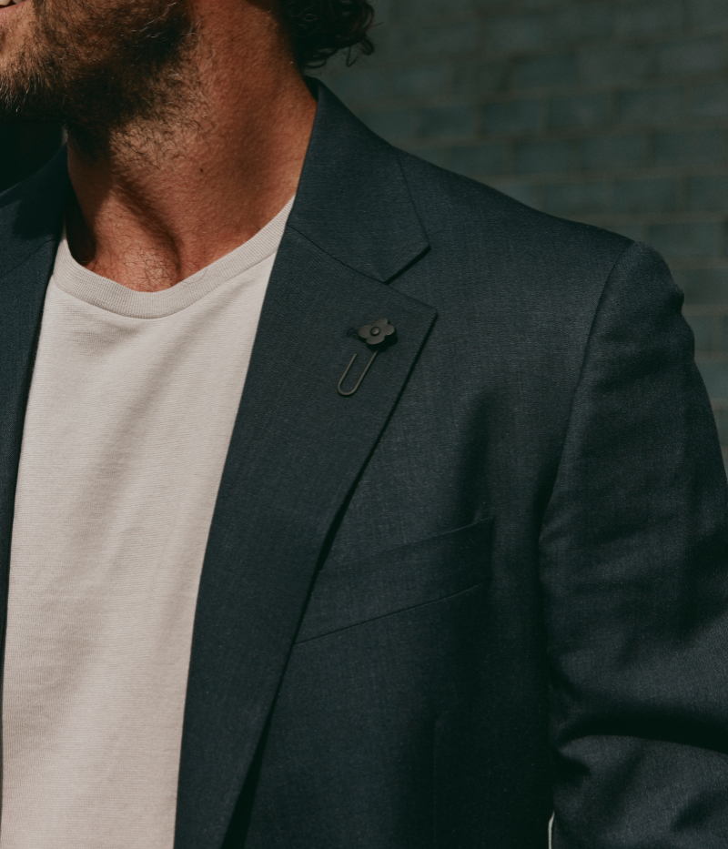 Navy Lardini tailored jacket featuring a single-breasted design, soft shoulders, and signature boutonnière detail, crafted in Italy from a blend of virgin wool and silk for a lightweight, elegant finish.