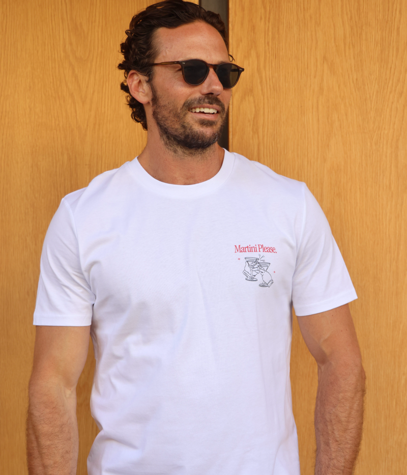 Front view of the "Martini Please" graphic tee, worn by a model. The classic fit and soft organic cotton make it effortlessly stylish, featuring a martini graphic and recipe for the perfect drink.