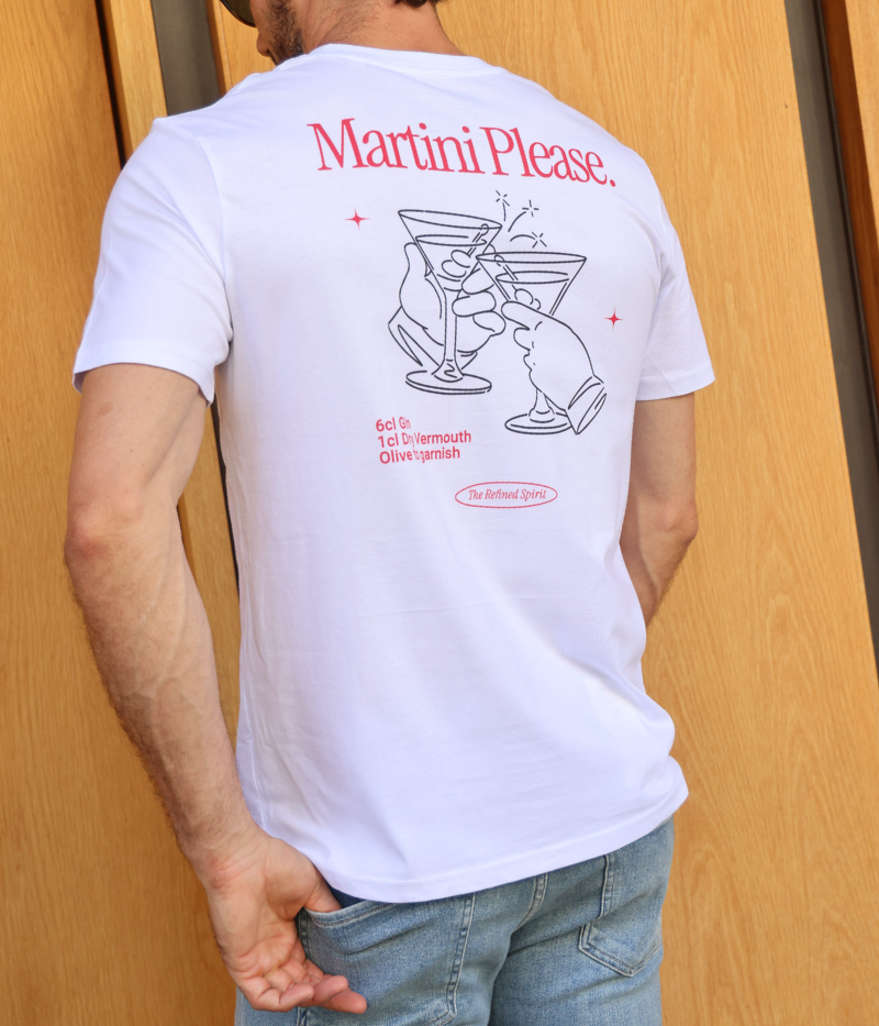 Back view of the "Martini Please" graphic tee, worn by a model. The classic fit and soft organic cotton make it effortlessly stylish, featuring a martini graphic and recipe for the perfect drink.