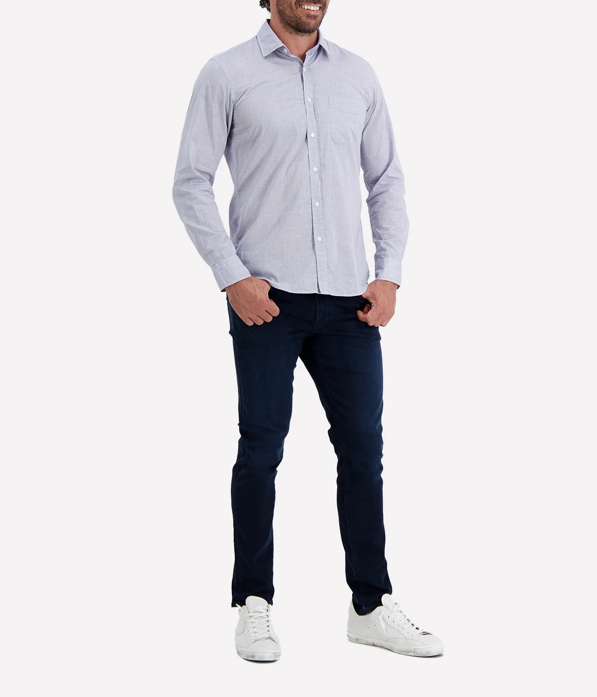 The Storm Pat Shirt by Hartford in Navy, featuring a light blue-like hue from a fine navy and white blend, crafted from 100% cotton twill. The shirt offers a slim fit, soft collar, chest pocket, and mother-of-pearl buttons, making it a versatile and stylish addition to any wardrobe.