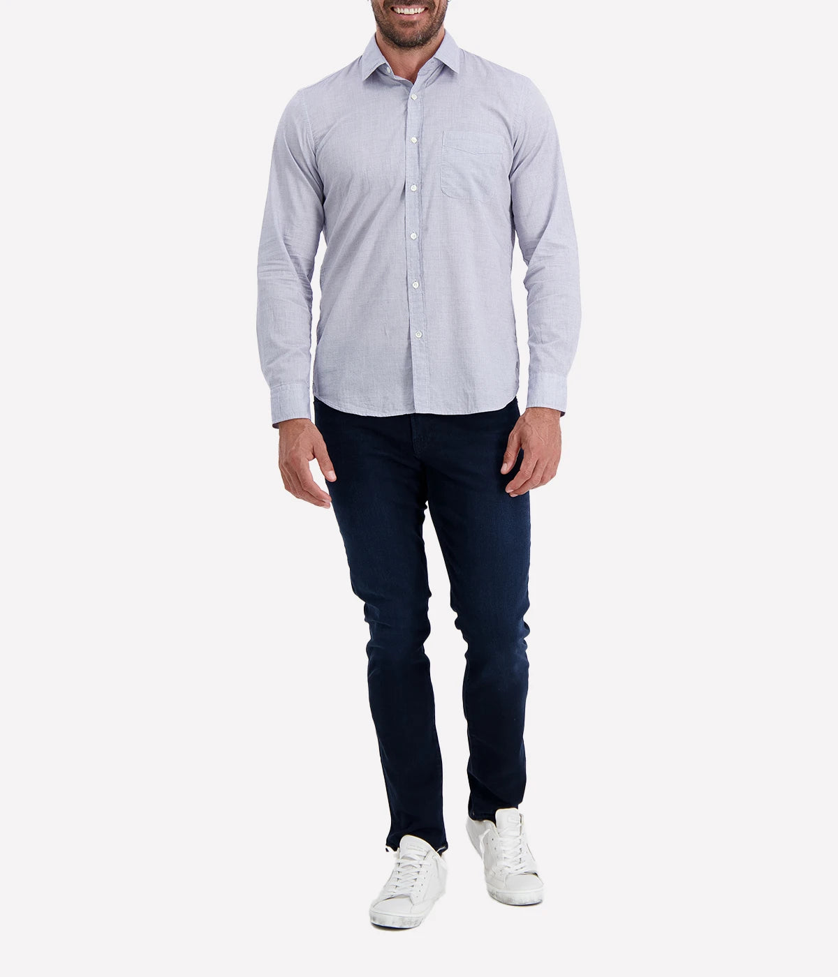 The Storm Pat Shirt by Hartford in Navy, featuring a light blue-like hue from a fine navy and white blend, crafted from 100% cotton twill. The shirt offers a slim fit, soft collar, chest pocket, and mother-of-pearl buttons, making it a versatile and stylish addition to any wardrobe.