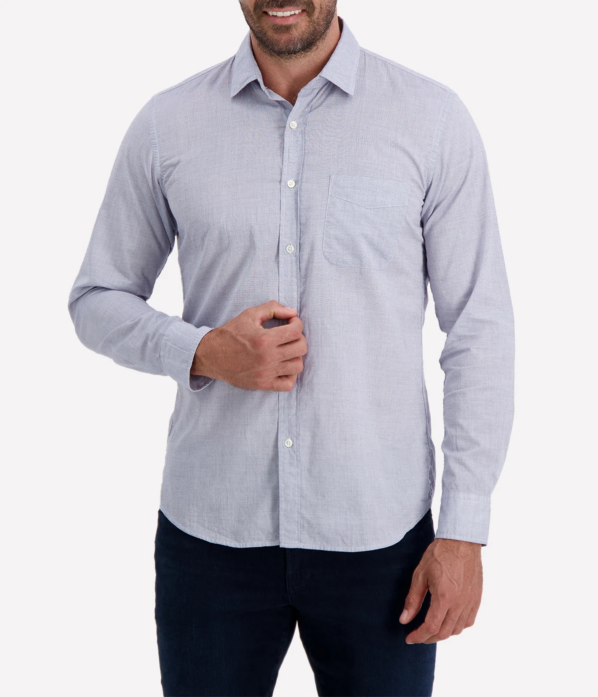 The Storm Pat Shirt by Hartford in Navy, featuring a light blue-like hue from a fine navy and white blend, crafted from 100% cotton twill. The shirt offers a slim fit, soft collar, chest pocket, and mother-of-pearl buttons, making it a versatile and stylish addition to any wardrobe.