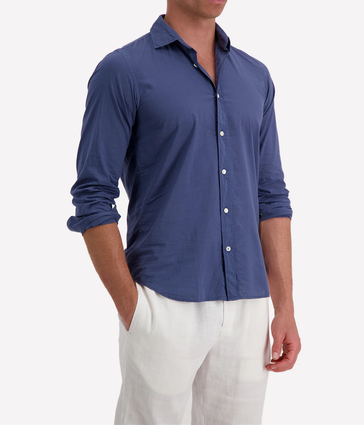 Model wearing the Hartford Sammy Shirt in lightweight cotton voile, featuring a pointed collar and buttoned cuffs. The slim fit creates a flattering, clean silhouette, perfect for casual summer styling.