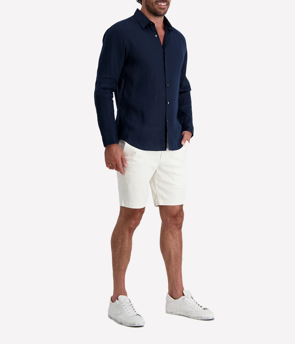 Theory Irving Relaxed Linen Shirt in Baltic navy. Classic point collar, button-front closure, and adjustable cuffs. Made from breathable, EU-grown flax linen for lightweight comfort and versatility.