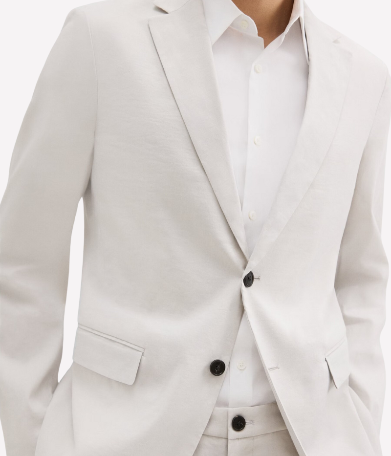 Theory Clinton Blazer in Good Linen, featuring a semi-constructed two-button design, notch lapels, and flap pockets. Breathable, lightweight, and made with sustainable stretch linen for all-day comfort.