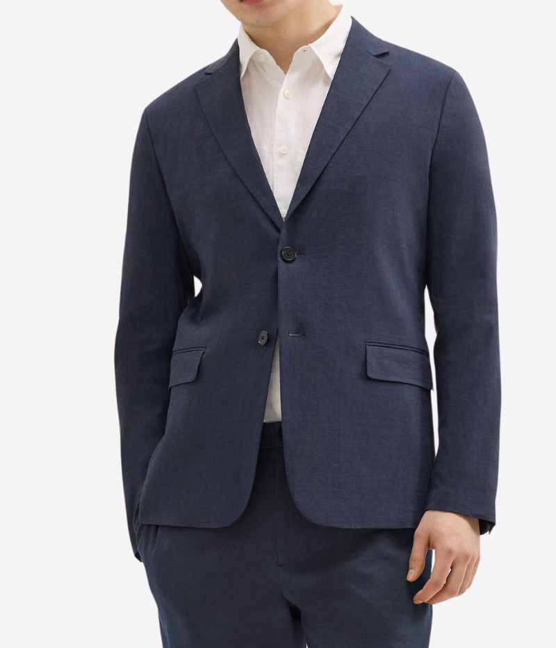 Theory Clinton Blazer in Good Linen, featuring a semi-constructed two-button design, notch lapels, and flap pockets. Breathable, lightweight, and made with sustainable stretch linen for all-day comfort.