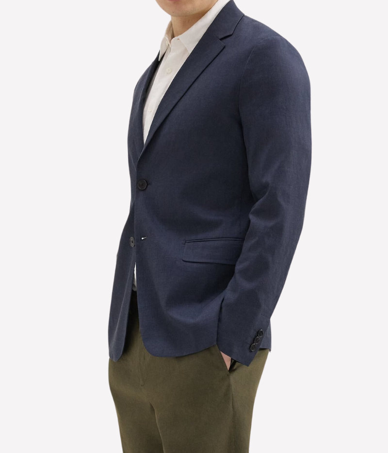 Theory Clinton Blazer in Good Linen, featuring a semi-constructed two-button design, notch lapels, and flap pockets. Breathable, lightweight, and made with sustainable stretch linen for all-day comfort.