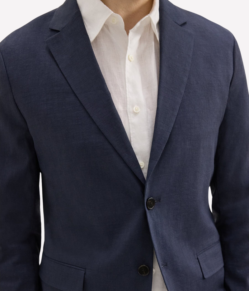 Theory Clinton Blazer in Good Linen, featuring a semi-constructed two-button design, notch lapels, and flap pockets. Breathable, lightweight, and made with sustainable stretch linen for all-day comfort.