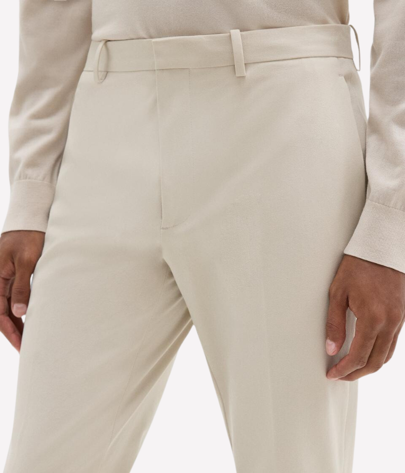 Theory Zaine Pant in New Sand, featuring a slim-straight leg, mid-rise fit, and bi-stretch twill fabric for all-day comfort. Made from a sustainable blend of recycled nylon and organic cotton.