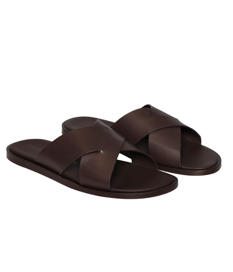 Men’s MURO sandals in luxury leather with wide criss-crossed straps, debossed Orlebar Brown logo on the padded insole, and flexible leather sole. Perfect for poolside lounging, beach walks, or casual summer outings.