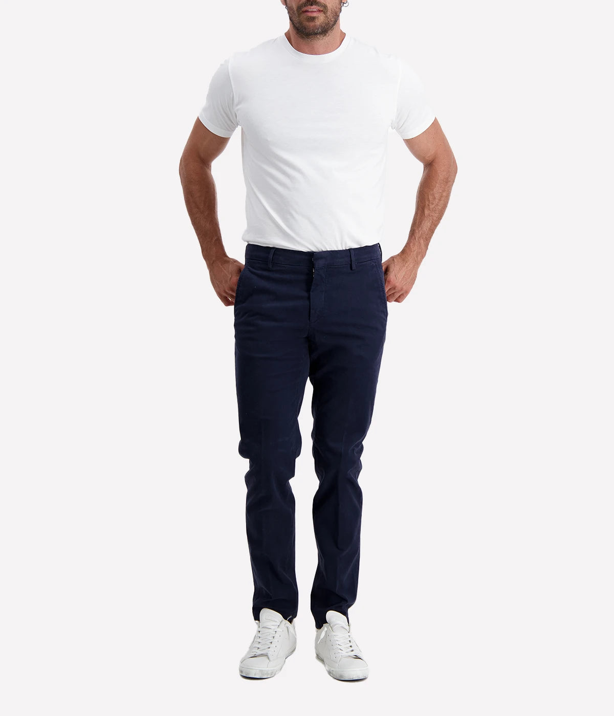 Slim fit chino trousers crafted from stretch cotton for a comfortable and flexible fit. Featuring a classic zip and button closure, front slant pockets, and welt pockets at the back for a polished and refined look. Perfect for both casual and formal occasions. Made in Italy. Material: 93% Cotton, 7% Elastane.