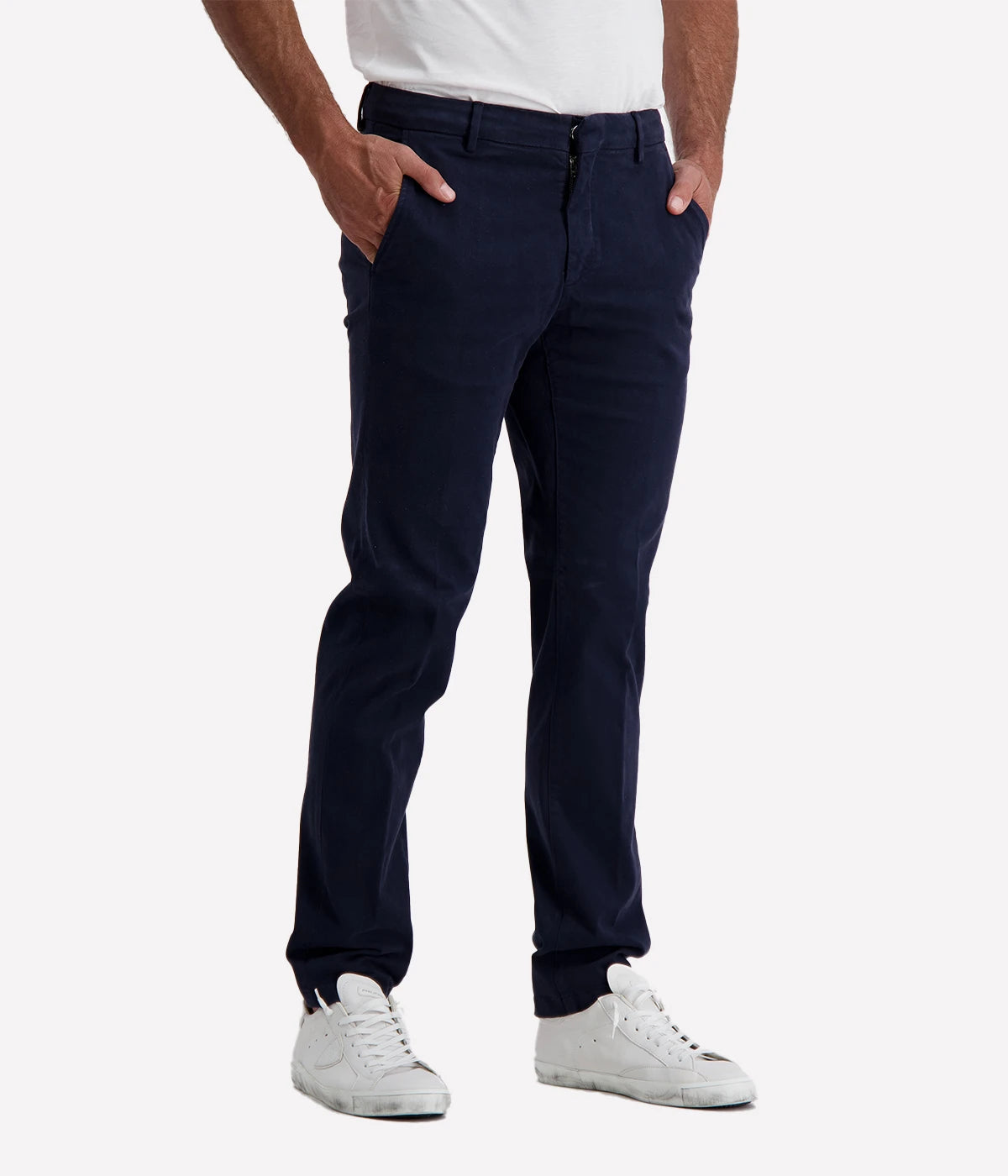 Slim fit chino trousers crafted from stretch cotton for a comfortable and flexible fit. Featuring a classic zip and button closure, front slant pockets, and welt pockets at the back for a polished and refined look. Perfect for both casual and formal occasions. Made in Italy. Material: 93% Cotton, 7% Elastane.