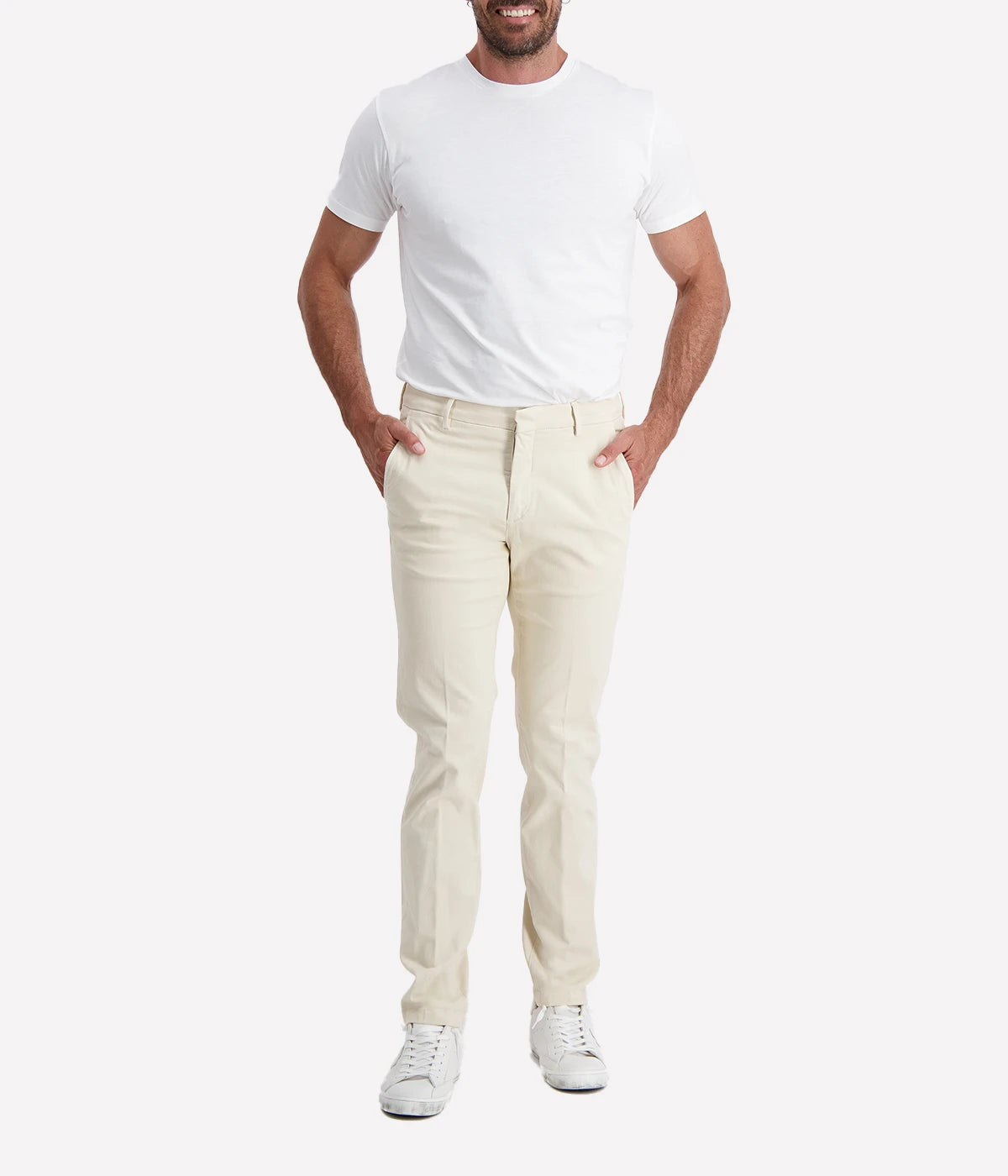 Slim-fit chino trousers crafted from stretch cotton for all-day comfort and ease of movement. Designed with a zip and button closure for a secure fit, front slant pockets for practicality, and welt back pockets for a refined finish. Perfect for both casual and smart occasions, these Italian-made chinos offer a sleek and sophisticated look.