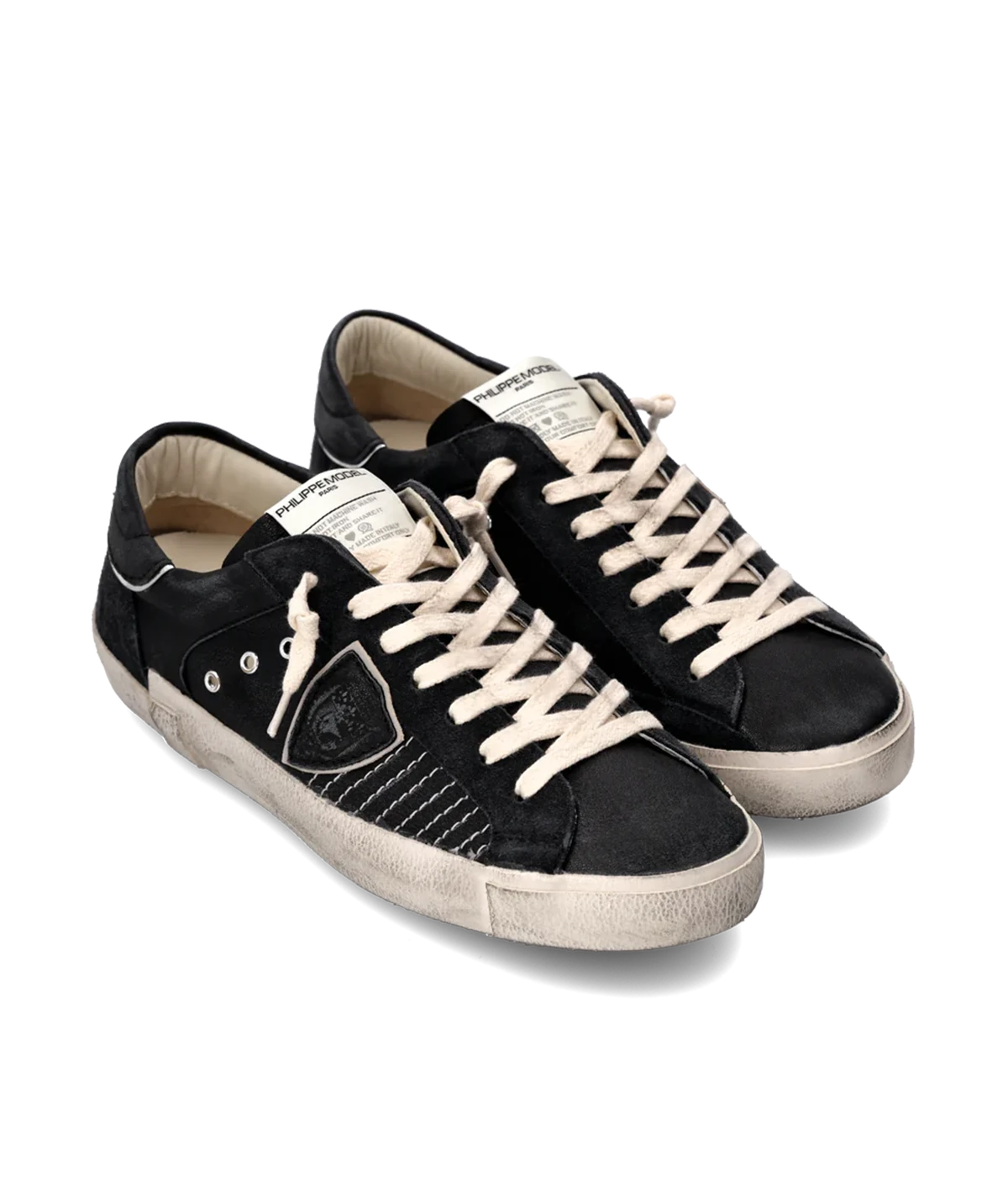 The PRSX sneaker blends ‘80s street style with French Riviera elegance, featuring a black suede and leather upper with contrast stitching, a handcrafted worn-effect sole, and premium comfort details.