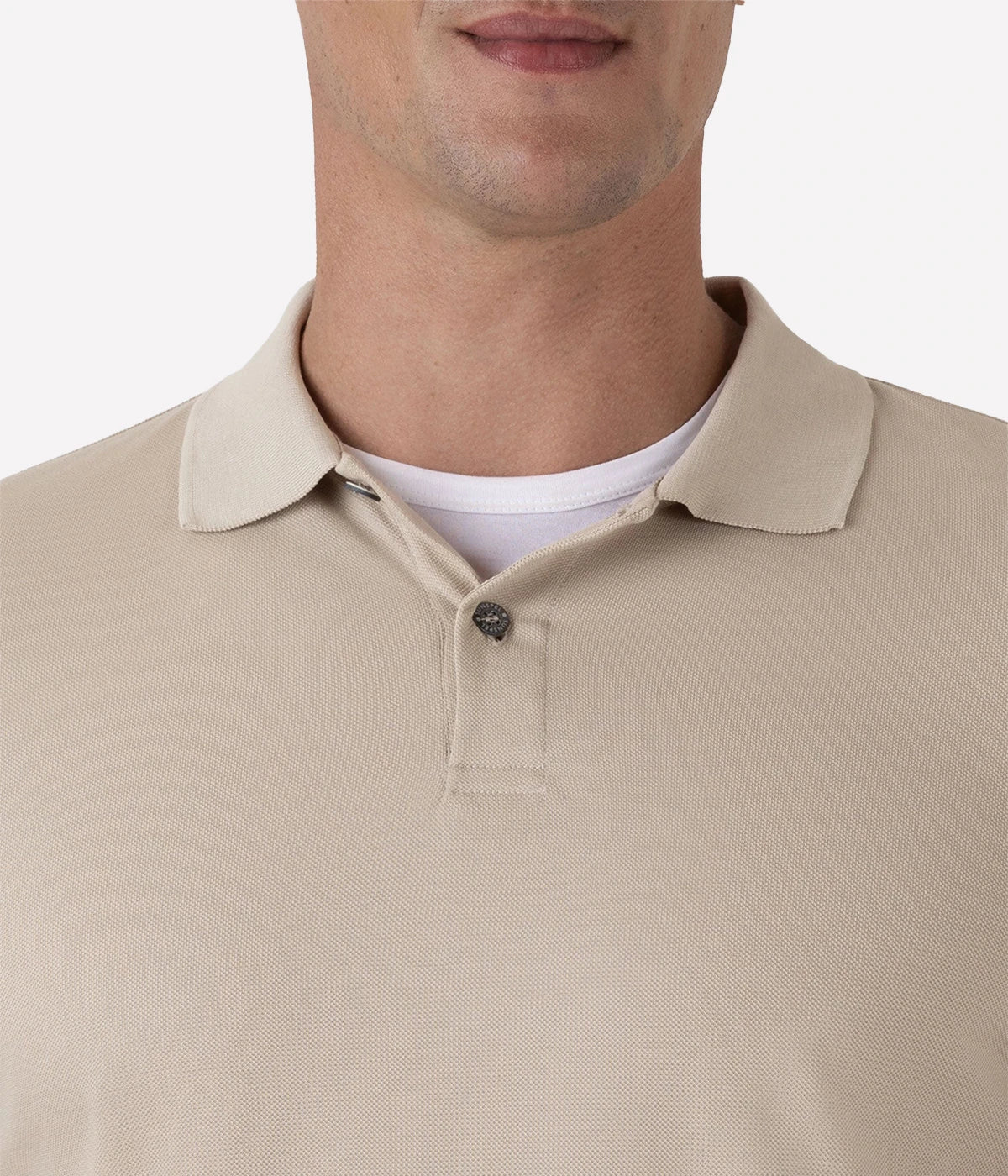 Ash grey piqué polo shirt for men made from Supima cotton. Features ribbed collar, side vents, and branded shell buttons for a sophisticated finish.