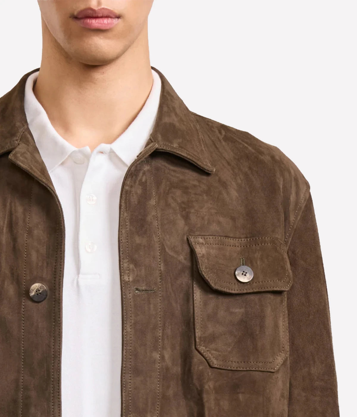 Ravi overshirt in 100% goat suede, featuring a classic collar, front button closure, flap utility pockets, and branded imitation stone buttons. Soft, durable, and crease-resistant with tonal stitching for a polished finish.