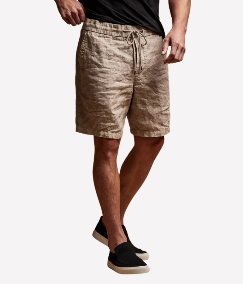 Relaxed Fit Linen Shorts in heavier linen fabric with a distinctive slub texture, featuring a clean front panel, elasticised waistband with drawcord, and slash front pockets. Garment-dyed for a lived-in, casual look.