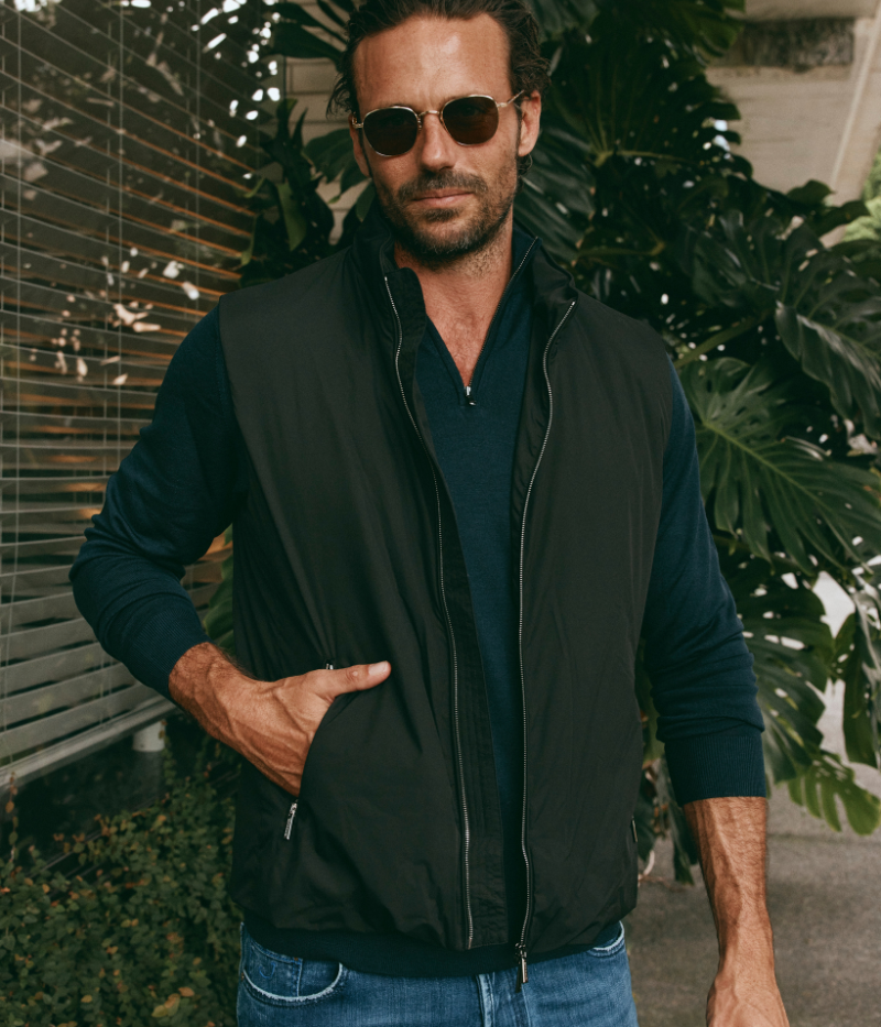 Senio Vest in Black by MooRER, featuring lightweight water-repellent fabric, synthetic feather-effect padding, double-zip front closure, and zippered pockets. Made in Italy.