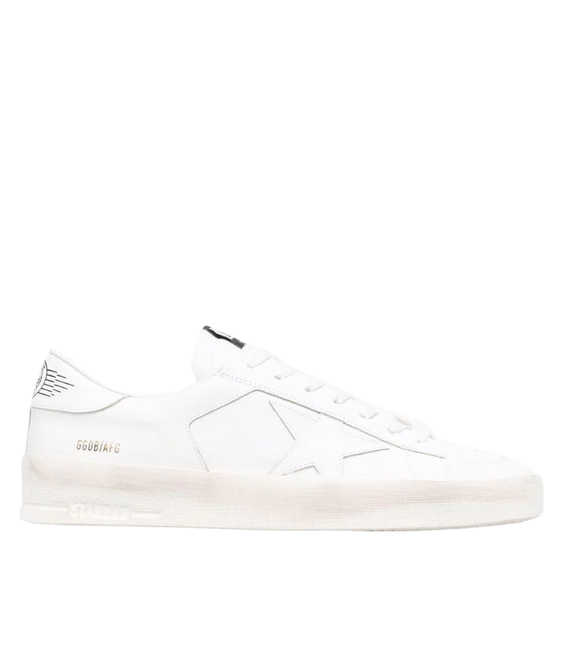 White Golden Goose Stardan sneakers in 100% cowhide leather, featuring a retro 90s basketball-inspired design. Minimalist all-white finish for a versatile, everyday look. Made in Italy.