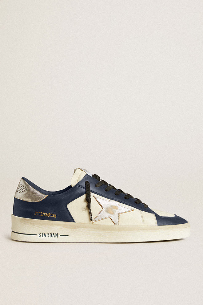 The Golden Goose Stardan Nappa Sneakers feature a luxurious Nappa leather upper with a sleek star toe and heel, combining sophistication and sporty style. The high-quality materials offer comfort and durability, making these sneakers a versatile addition to any wardrobe. Perfect for elevating both casual and dressed-up looks.