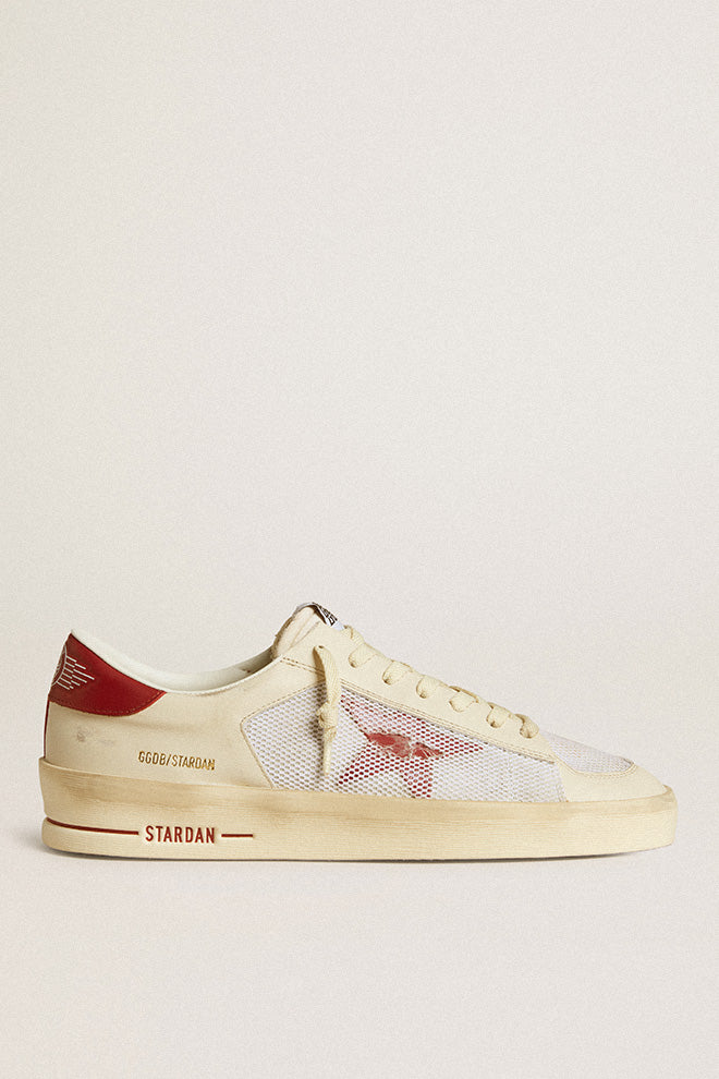 Golden Goose Stardan Sneaker in White and Red, featuring a suede and leather upper with red leather toe and star details. The sneakers have a leather heel, rubber sole for durability, and a breathable lining for comfort, offering a bold, stylish look.