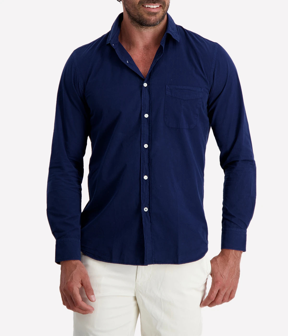 The Storm Pat Shirt by Hartford in Ink Blue, crafted from 100% cotton twill with a garment-dyed finish. This shirt features a slim fit, soft collar, chest pocket, and mother-of-pearl buttons, offering a timeless and versatile look suitable for both casual and semi-formal occasions.