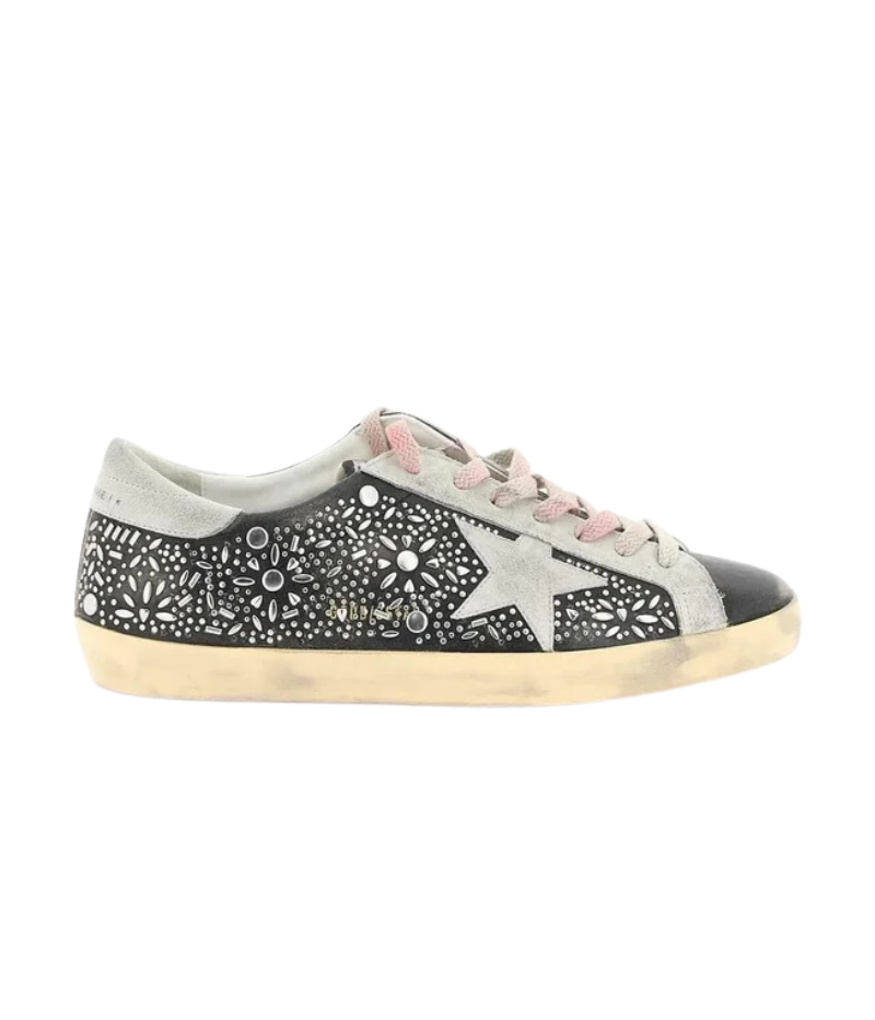 Side profile of Golden Goose Black Ice Super-Star Sneakers, showcasing the iconic star detail, metallic studs, and contrasting suede inserts for a bold, textured look.