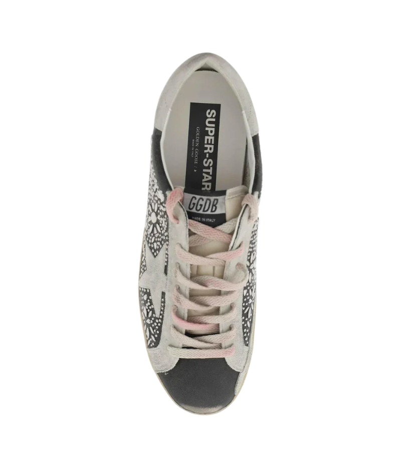 Overhead view of Golden Goose Black Ice Super-Star Studded Sneakers, showing the lace-up closure, signature star design, and glitter accents for a bold, fashion-forward style.