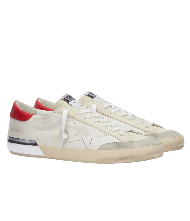 Side profile of Golden Goose Super-Star Sneaker in red and silver, showcasing the handcrafted scuffs and iconic perforated star detail that give a lived-in feel.