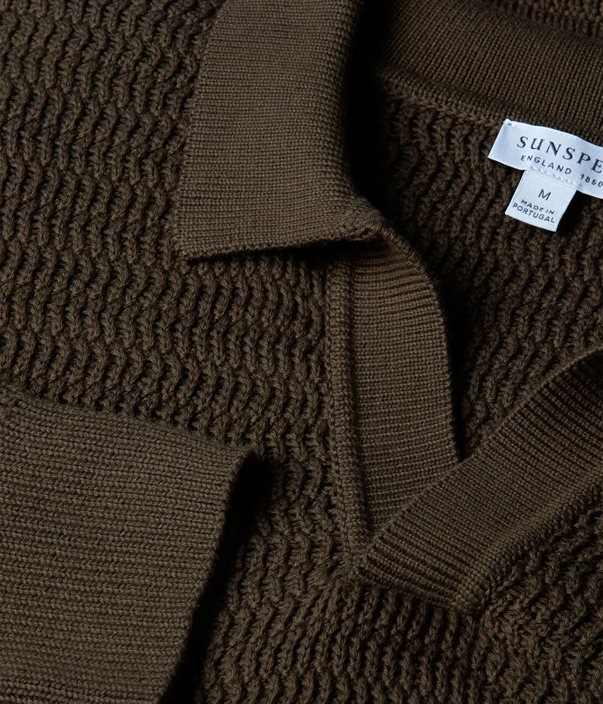 Khaki open-stitch polo in luxurious Egyptian cotton, featuring a buttonless collar, ribbed trims, and a soft, breathable feel.