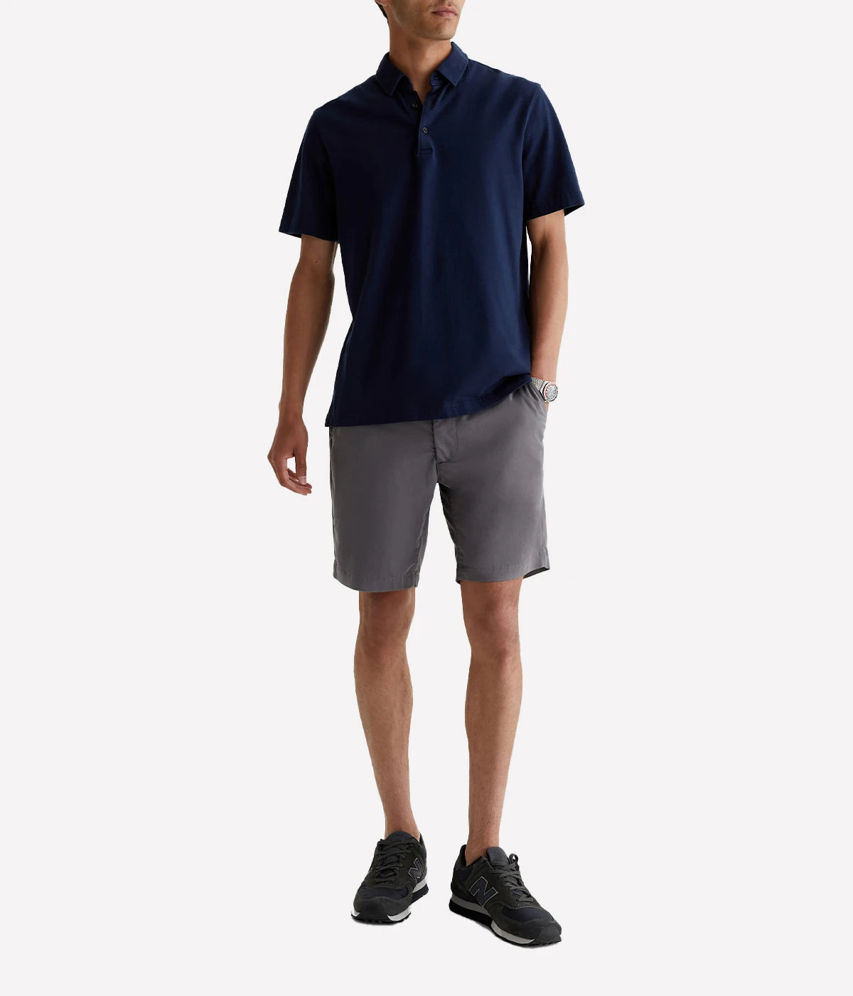 AG Wanderer Shorts styled with a short-sleeve polo shirt and sneakers, showcasing a relaxed yet polished outfit for versatile, everyday wear.